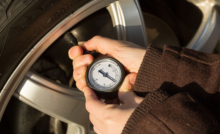 Tire pressure guage attached to a tire